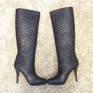 Versace knee-length quilted black boots.